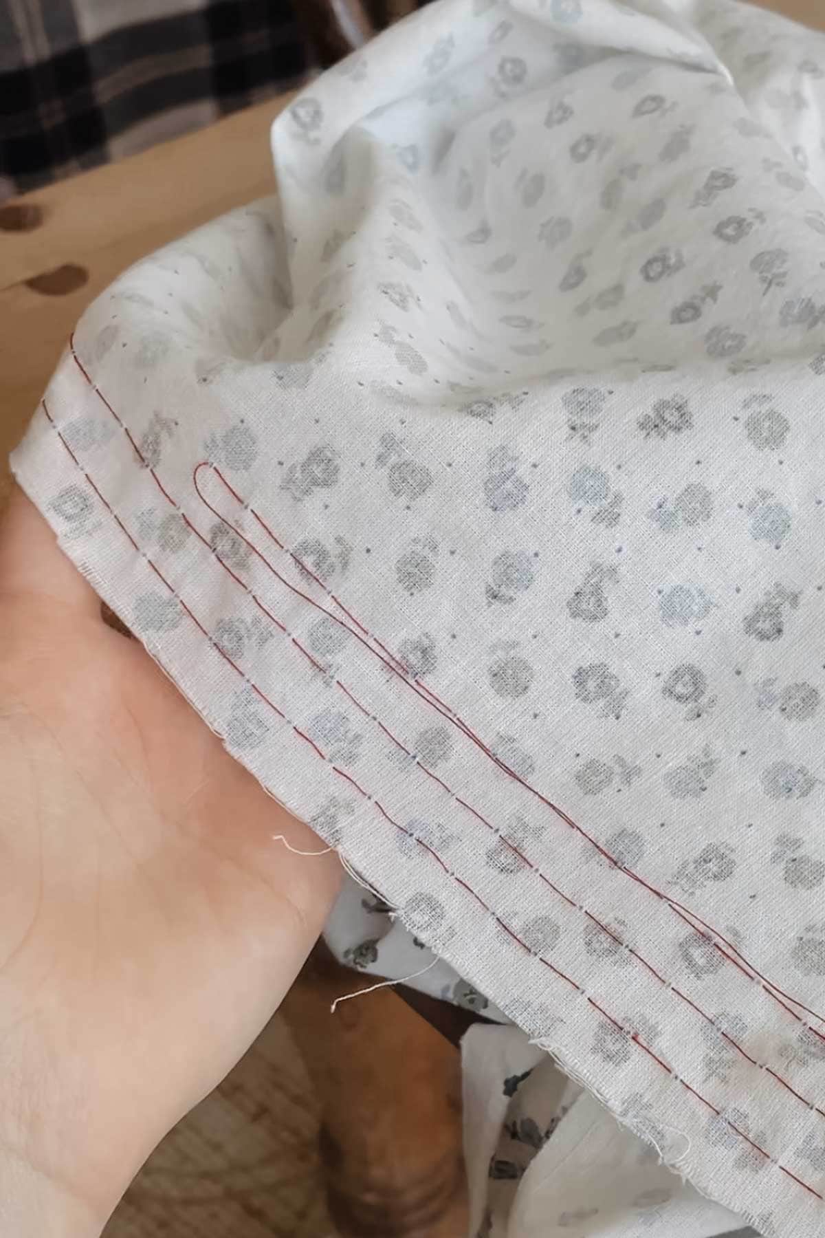 Fabric with hand sewn lines ready to pleat the fabric for smocking