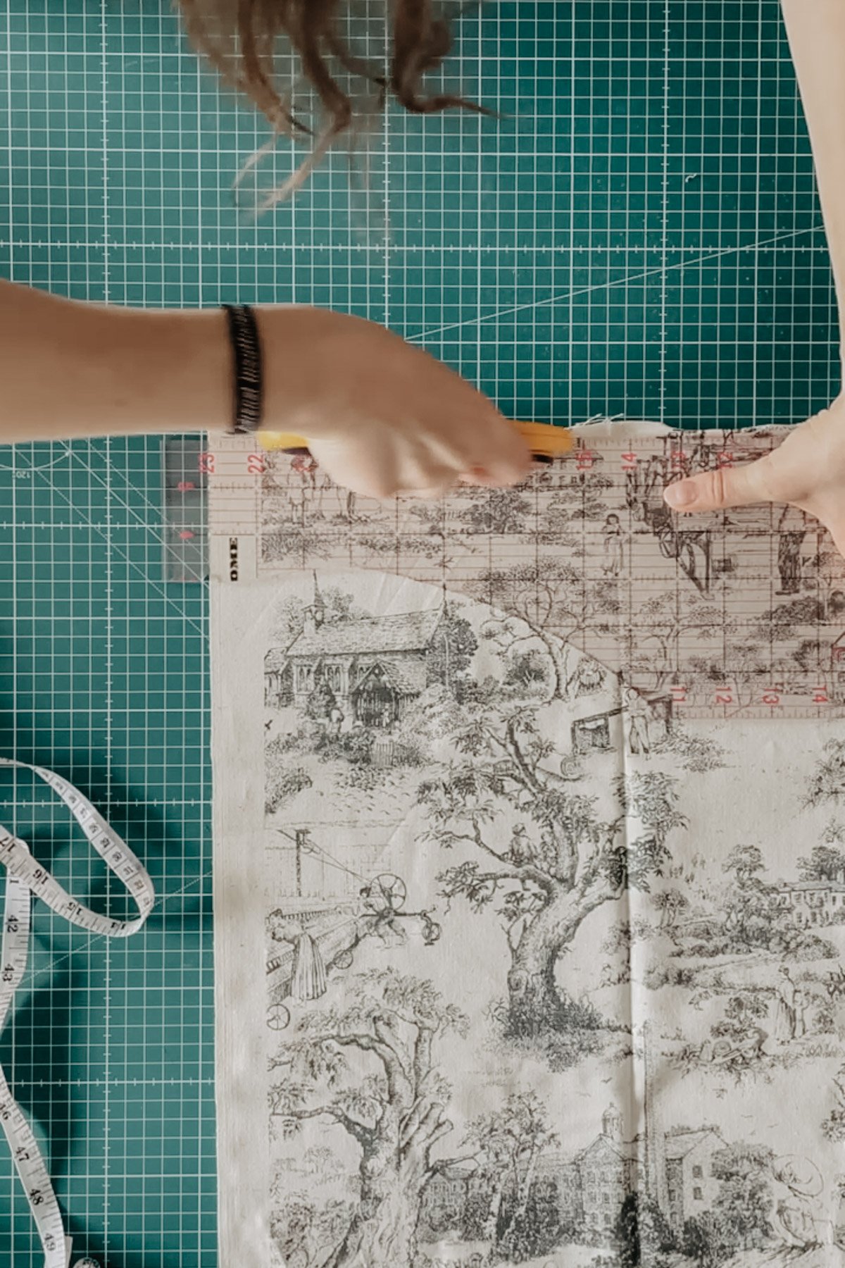 Toile fabric is cut with a rotary cutter