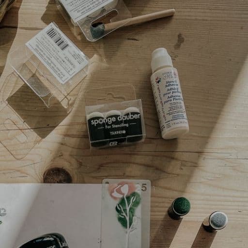 Sponge daubers, stencil adhesive and painted flowers