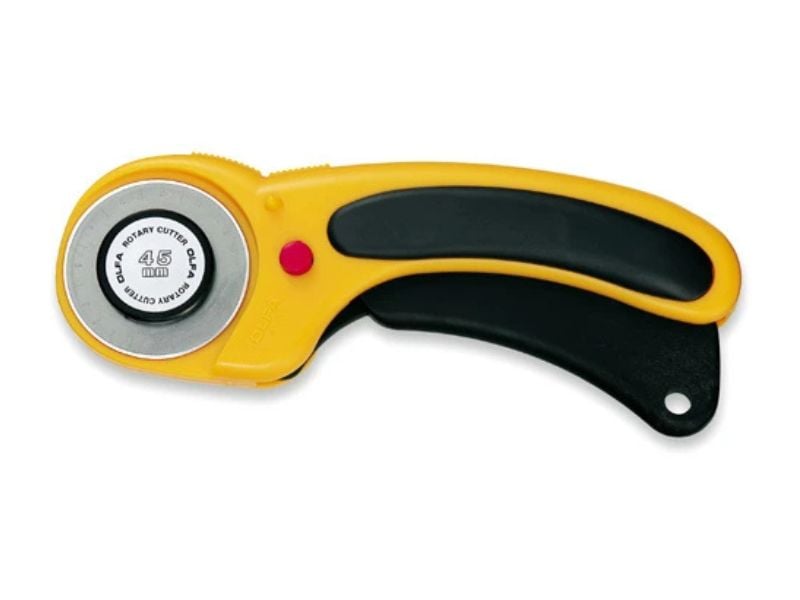 A yellow and black rotary cutter with a 45 mm circular blade, used for cutting fabric or paper, helps you sew faster. It’s shown against a white background.