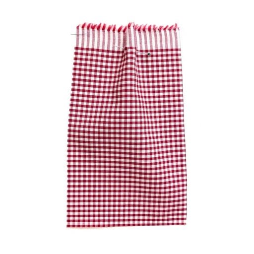 A red and white chequered swatch of fabric hangs vertically.